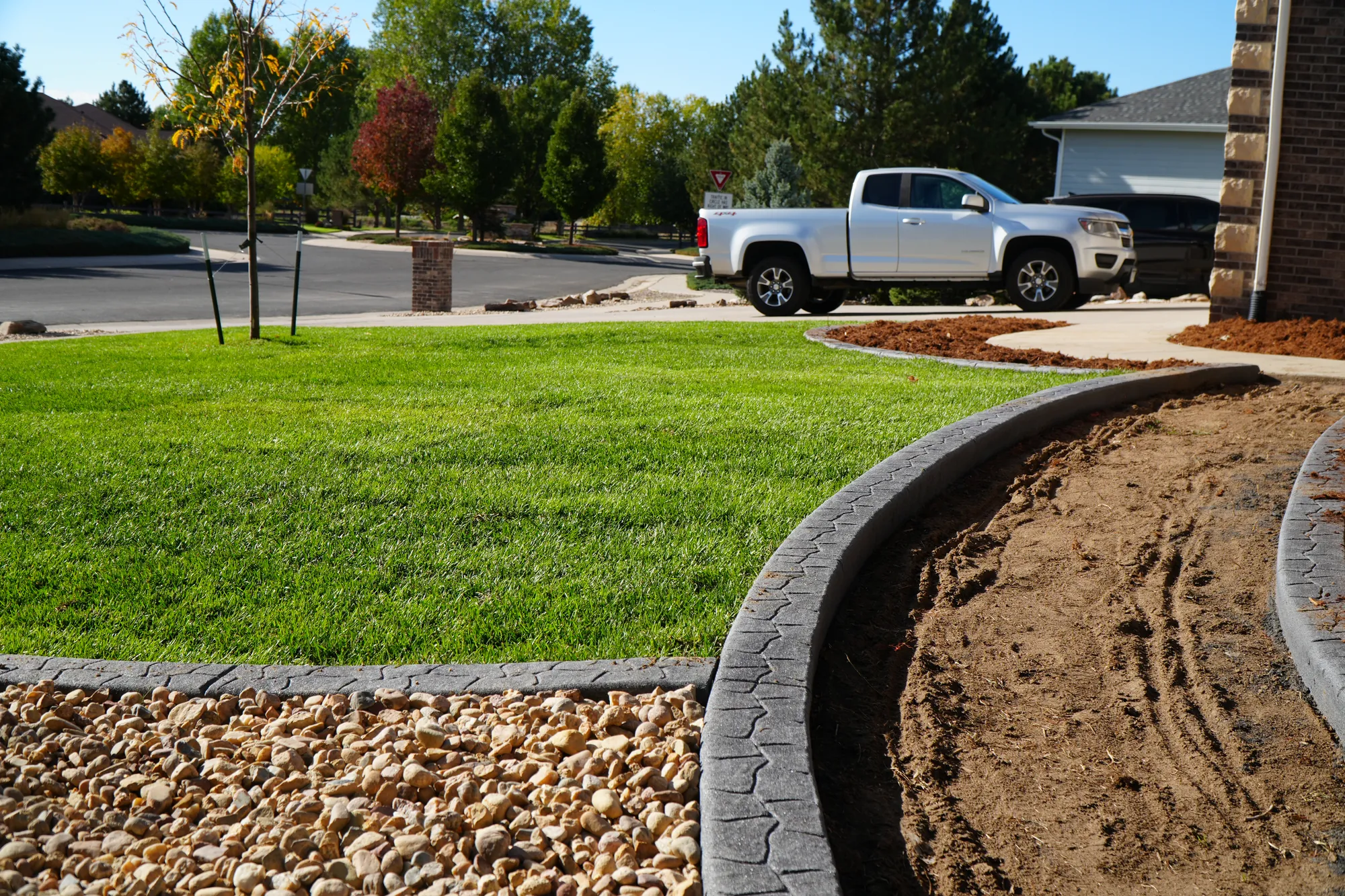 Concrete Curbing: decorative curbing going in before rock and sod